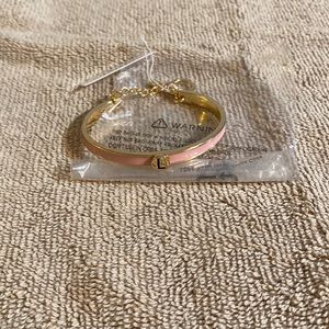 Pink BCBG bracelet. Letter L